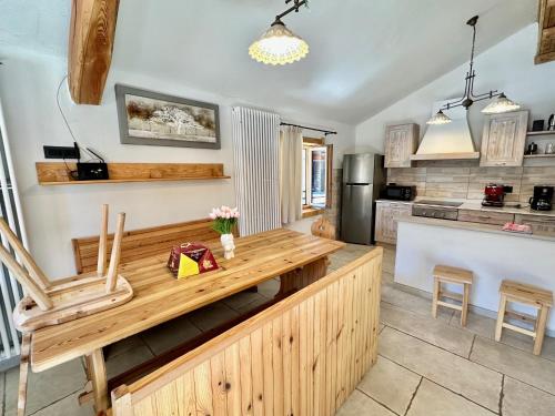 a kitchen with a wooden counter top in a room at Chalet Paradisi in Castello Tesino
