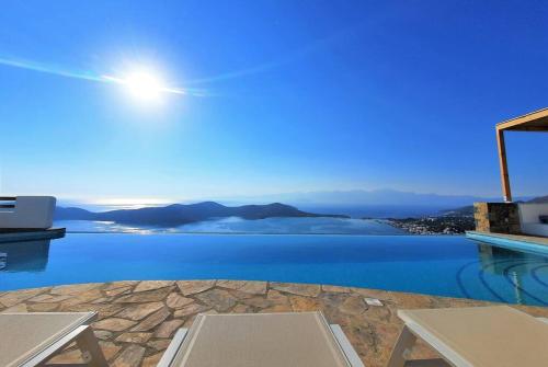 a view of the ocean from a house at Luxury Villa Orea, Elounda (owner's listing) in Epáno Eloúnda