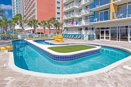 a swimming pool in the middle of a building at Amazing Atlantica Condo 1st Floor in Myrtle Beach