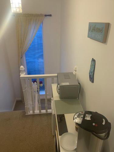 a bathroom with a phone sitting on a toilet at Valentia Skellig Rooms in Valentia Island