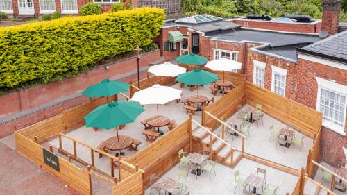 an overhead view of a patio with tables and umbrellas at Mount Pleasant Hotel in Great Malvern