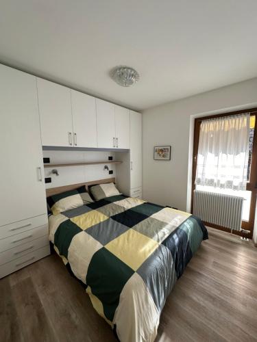 a bedroom with a large bed in a room at Casa Vacanza La Croseta in Trento