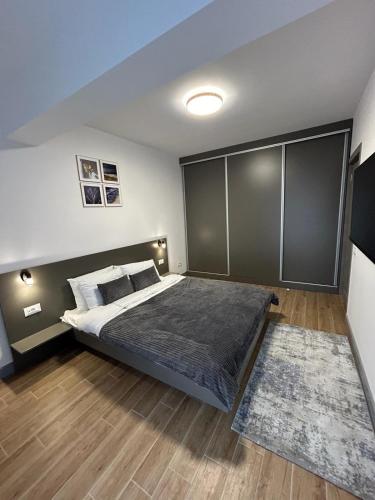 Ένα ή περισσότερα κρεβάτια σε δωμάτιο στο B.L Apartaments