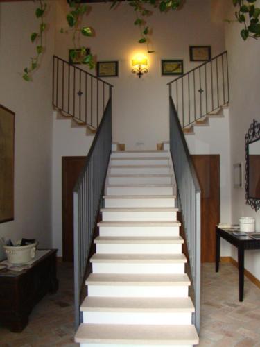 a staircase with white steps in a room at Villa Schiavi in Sermide