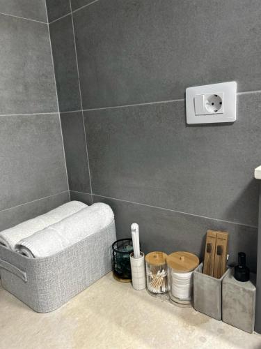a bathroom with a towel rack in the corner at B.L Apartaments in Bucharest
