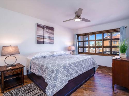 a bedroom with a bed and a ceiling fan at La Hacienda San Felipe Rental Condo 2 in San Felipe
