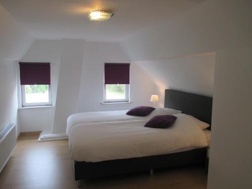 Säng eller sängar i ett rum på Ferienhaus Rheiderland