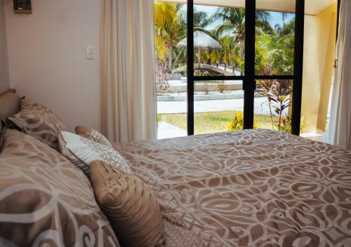 Кровать или кровати в номере A unos pasos de la Playa,disfruta la tranquilidad villa 9