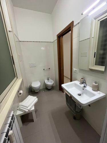 a bathroom with a sink and a toilet at Monti Exclusive Apartment in Rome