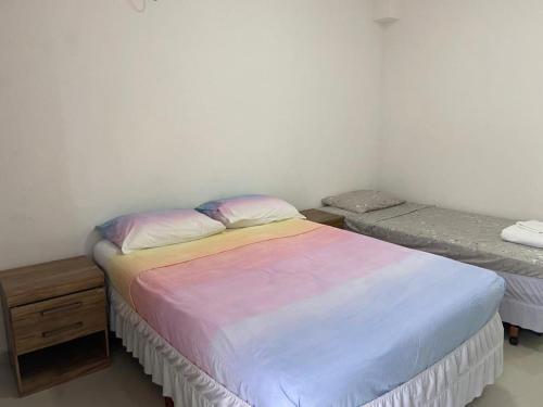 Ein Bett oder Betten in einem Zimmer der Unterkunft Apart-Hotel "Encantos do Mar" - Beira Mar