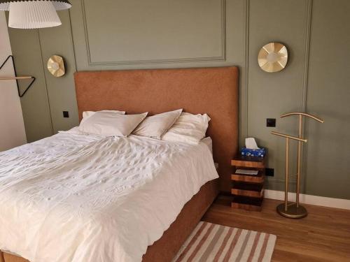 מיטה או מיטות בחדר ב-Maison 160m2 à 15 min de PARIS/accord arena bercy