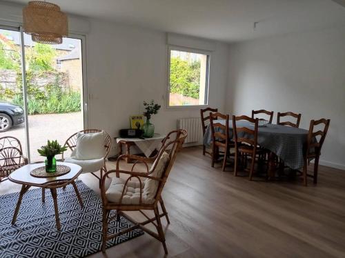 a living room with a dining room table and chairs at Résidence -pleneuf Val Andre - Maisons & Villas 494 in Pléneuf-Val-André