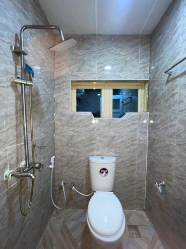a bathroom with a toilet and a shower at Mph 4 in Lagos