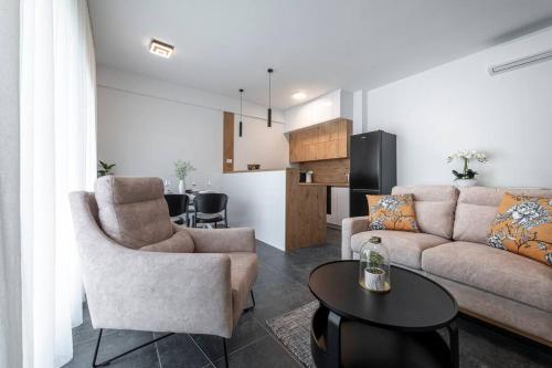 a living room with a couch and a table at Diva Apartment Dubrovnik in Dubrovnik