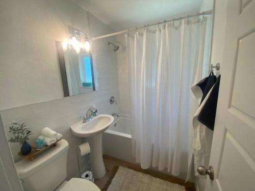 a bathroom with a sink and a toilet and a shower at Walking Distance to University Mall Big Backyard in Orem