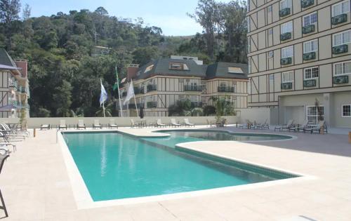 Bazén v ubytování STUDIO ALTO PADRÃO ITAIPAVA nebo v jeho okolí