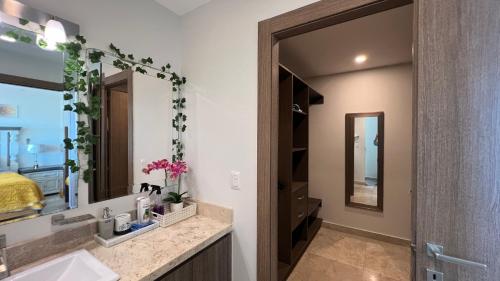 a bathroom with a sink and a mirror at Mar Laguna Hotel in Mazatlán