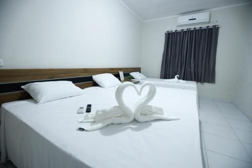 Ένα ή περισσότερα κρεβάτια σε δωμάτιο στο Pousada Oásis do Cariri