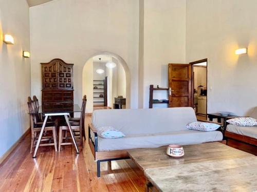 a living room with a couch and a table at La Casa del Teide, d-espacios in La Orotava