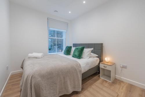 Ένα ή περισσότερα κρεβάτια σε δωμάτιο στο Cosy 2 Bedroom Flat in Lake District
