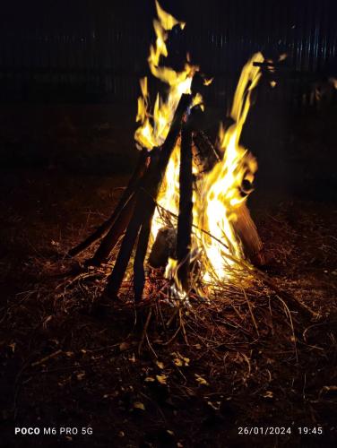 a fire is burning in a bonfire at night at Sunset View Gulmarg in Gulmarg