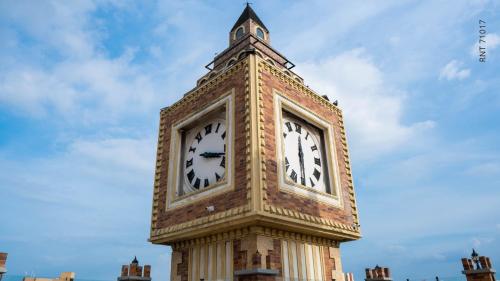 a tower with a clock on top of it at Hotel Windsor Barranquilla in Barranquilla