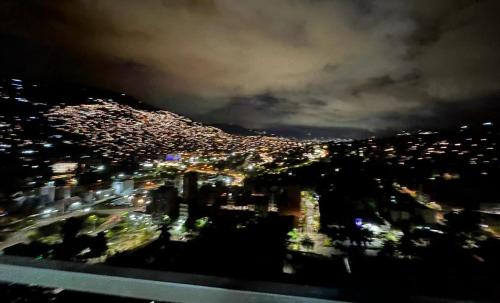 a view of a city at night with lights at Casalba in Bello