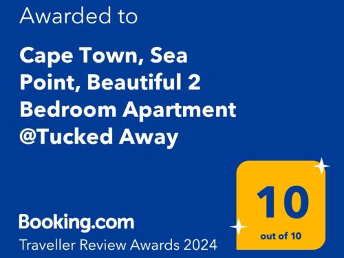 un signe jaune avec son numéro dans l'établissement Cape Town, Sea Point, Beautiful 2 Bedroom Apartment @Tucked Away, au Cap