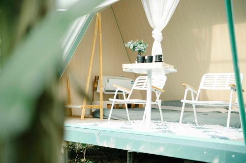 a group of chairs and a table in a tent at An Suối Garden Tri Tôn An Giang 