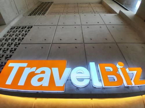 an orange and blue sign on the floor of a building at TRAVELBIZ HOTEL in Medan