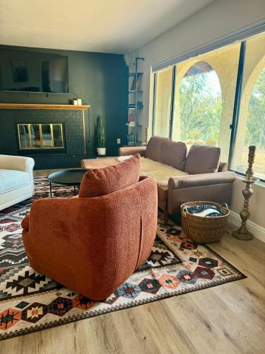 a living room with a couch and a table at San Diego Trail Guest Ranch in Poway