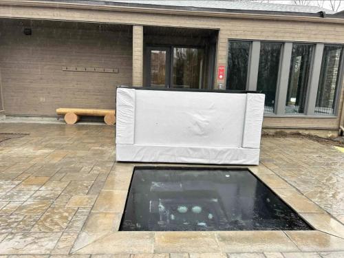 a white bath tub sitting in front of a building at Tremblant Luxe 3BR Pet-friendly, Entertainment! in Mont-Tremblant