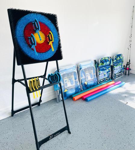 a chair with a painting on the back of it at NEW Renovated luxury home with private heated pool, game room Near Anna Maria Island and IMG in Bradenton