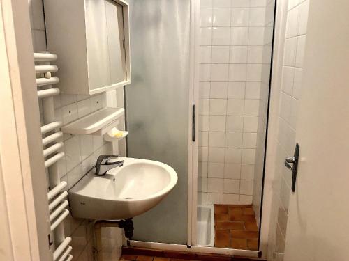 a small bathroom with a sink and a shower at Maison Charmante Près Plage et Forêt, 5 Ch., Jardin, Parking, Quartier Calme - FR-1-652-2 in Saint-Jean-de-Monts