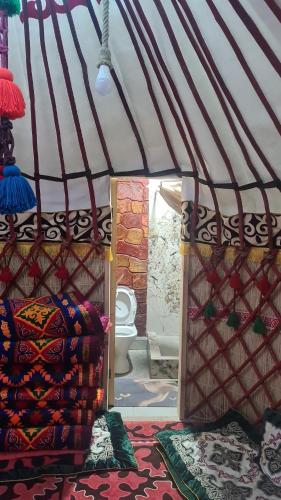 a room with a yurt with a toilet in it at Кереге-Таш in Karakol