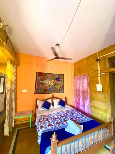 a bedroom with a bed in a room at Hostel Little Prince Home Stay in Jaisalmer