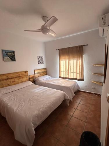מיטה או מיטות בחדר ב-Villa Garpellado