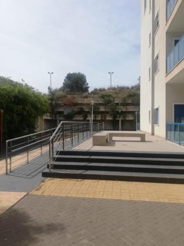 a group of stairs next to a building at Apartamento confortable en la bahia de Alicante in Alicante