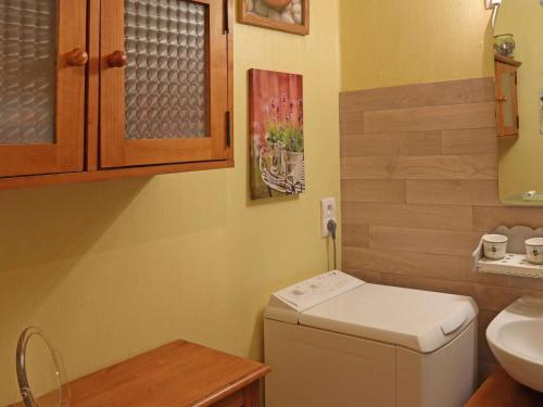 a small bathroom with a sink and a washing machine at Studio Les Orres, 1 pièce, 5 personnes - FR-1-322-600 in Les Orres