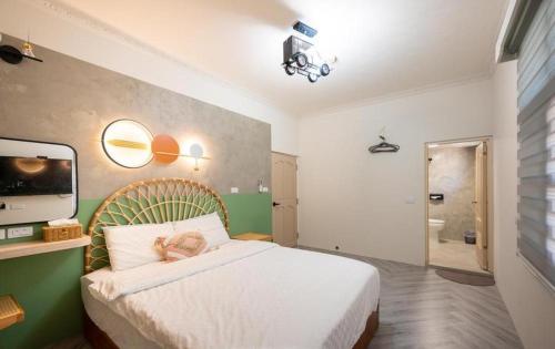 Ein Bett oder Betten in einem Zimmer der Unterkunft Light of the Dawn