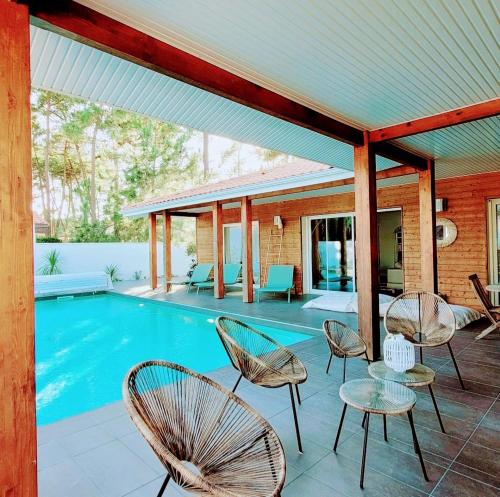 Villa_palms_mimizan_plage jolie villa 12 personnes, piscine chauffée et plage à pied