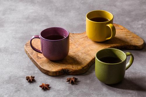 two cups of coffee on a wooden cutting board at Grand Mercure Ise-shima Resort & Spa in Shima