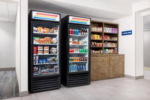 two refrigerators in a store with food and drinks at Holiday Inn Express Las Vegas Stadium Area by IHG in Las Vegas