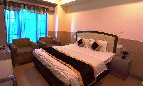 Ліжко або ліжка в номері Hotel Shorya