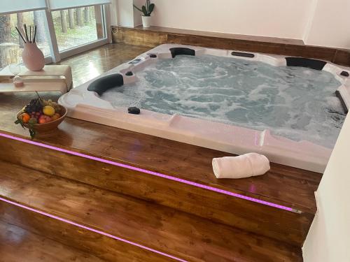 a large jacuzzi tub in a living room at Agriturismo La Locanda Del Parco in Morano Calabro