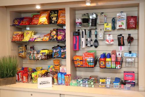 a store shelf filled with different types of food at Four Points by Sheraton Wakefield Boston Hotel & Conference Center in Wakefield