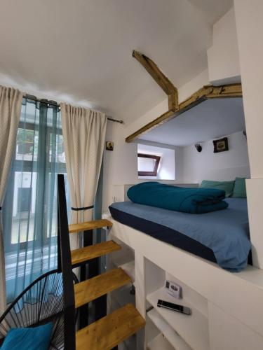 a bedroom with a bunk bed and a staircase at Casa Silvia in Cluj-Napoca