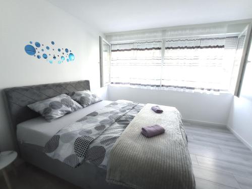 Postel nebo postele na pokoji v ubytování Apartman Sunce
