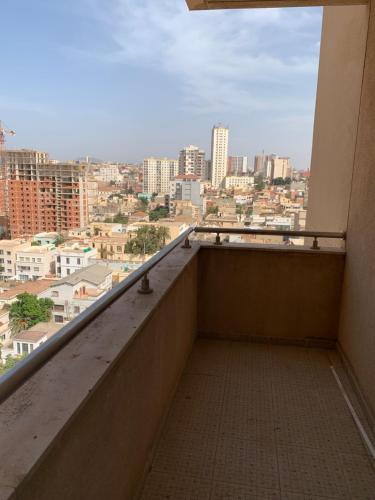a balcony with a view of a city at charmant appartement a oran gambetta pour famille in Oran