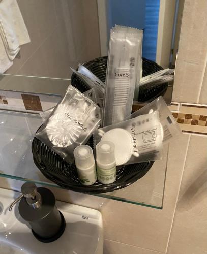 a basket of toiletries on a counter in a bathroom at Villa Alta in Villalba